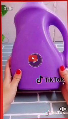 a woman holding a purple jug with red nail polish on her nails and the words tiktok next to it