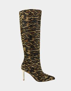 Unleash your wild side with the BREA LEOPARD tall shaft boot! This fierce footwear features a pointed toe and sparkling leopard rhinestones, adding some extra flair to your wardrobe. Perfect for making a statement and standing out from the crowd. (Don't be afraid to show off your inner beast!) Synthetic upper material with rhinestones Side zipper closure Synthetic sock/lining Synthetic Betsey Blue sole Synthetic gold metallic wrapped stiletto 3.25 inch heel height 15.5 inch shaft height 15.5 inc Leopard Print High Heel Boots For Party, Leopard Print Party Boots For Winter, Leopard Print Winter Party Boots, Leopard Print Boots For Fall Party, Winter Party Leopard Print Boots, Fall Party Leopard Print Boots, Pointed Toe Leopard Print Party Boots, Sequin Boots For Night Out In Fall, Sequin Boots For Fall Night Out