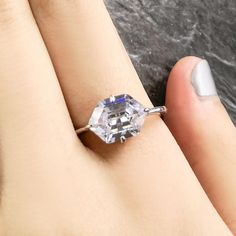 A unique gem-cut that makes a strong impression.Delivery in 3 - 5 Weeks Features:  Main Stone: AVENA Diamond Main Gem-Cut: Hexagon Main Stone Carats: 3.6 (Approx.)Main Stone Dimensions: 6 * 12 mmSetting: 4 Prong Gem Arrangement: Solitaire Secondary Stone: -Accent Stone: - Band Style: StraightBand Embellishment: -Metal: Silver Octagon Crystal Elegant Ring, Elegant Silver Octagon Crystal Ring, Silver Octagon Crystal Promise Ring, Elegant Octagon Crystal Promise Ring, Elegant Octagon Crystal Ring For Anniversary, New Jewellery Designs, Cheap Engagement Rings, Morning Star, Jewellery Designs