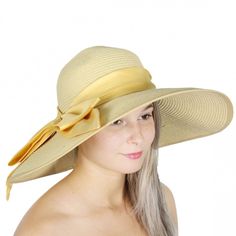 Large Satin Bow Sun Hat Thick Band With A Large Satin Bow Measurements: Brim: 5 Inches, Crown Height: 4 Inches, Crown Diameter: 7.5 Inches Beige Straw Hat For Spring, Cream Sun Hat For Spring, Gold Wide Brim Sun Hat For Spring, Gold Wide-brim Sun Hat For Spring, Cream Spring Hat One Size, Chic Yellow Hat For The Beach, Chic Yellow Beach Hat, Beige Floppy Straw Hat For Spring, Adjustable Floppy Hat