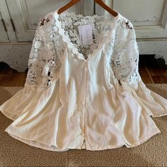 We Are Obsessed With This Bohemian Blouse. This Pretty Blouse Features A Soft White Cotton Base, Button Front, Lace Floral Details And Feminine Fit. + Well Made + Heather Is 5'8" Tall / 140lbs And Modeling A Size Medium + Soft Cotton Blend + Oversized Blousy Fit When Not Tucked In + Size Down One Size If You Want More Of A Fitted Look Ships Fast From Our Studio In Washington State! Approx. Measurements: Small: Pit To Pit: 21", Length: 25" Medium: Pit To Pit: 22", Length: 25" Large: Pit To Pit: 2 Lace Cottagecore, Tribe Design, 70s Tops, Lagenlook Clothing, Morning Dress, Bohemian Blouse, Clothing Studio, Romantic Tops, Romantic Blouses