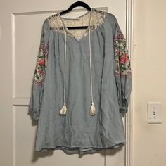 Loose Fitting And So Great To Dress Up Or Down! Beautiful Details. Made By A Great Designer Who I Own Tons Of Pieces From.., Just Getting Rid Of Ones I Don’t Wear. Size Small But Loose. Never Worn. Wrinkled From Storage. All Reasonable Offers Will Be Considered Blue V-neck Boho Dress For Spring, Blue Floral Embroidered Summer Dress, Blue Cotton Long Sleeve Mini Dress, Blue Cotton Boho Dress For Summer, Blue Long Sleeve Cotton Mini Dress, Casual Blue Mini Dress With Floral Embroidery, Fitted Blue Casual Tunic, Fitted Casual Blue Tunic, Casual Blue Spring Tunic