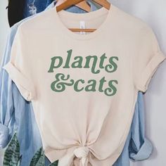 Cats and Plants shirt, Plant Shirt, Gardener t-shirt, gift for plant lover, Cat lover shirt, Retro plants shirt, Plant lady, Plant Mom Discover the purr-fect blend of your two favorite things with our Cats & Plants unisex T-shirt! This trendy and comfortable tee is a must-have for any cat lover and plant enthusiast. Made with high-quality, soft bella canvas, it features a charming graphic that creatively combines adorable cats with lush green plants. Available in a variety of sizes and popular c Plant Mom Shirt, Spring Relaxed Fit T-shirt With Plant Details, Casual Summer Tops With Plant Details, Plant Tshirts, Farmstand Recipes, Cats Plants, Gift For Plant Lover, Cat Plants, Cat Lover Shirt