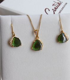 Featured in TATLER UK December 2018 issue: Unique and one of a kind, skilfully handcrafted solid 18k Gold pendant with a smooth polished deep emerald green bi-color Tourmaline slice with a darker green center, with 3 small water clear Diamonds on one side of the pendant, and 2 more Diamonds on the pendant bail. Size of the pendant without the bail and the ring is about 11 x 11 mm. Total length of the pendant from the top of the bail is about 20 mm. Please note that the chain is not included in t Formal Teardrop Tourmaline Jewelry, Formal Yellow Gold Tourmaline Jewelry, Pear-shaped Tourmaline Gemstone Jewelry, Formal Green Tourmaline Necklace, Green Tourmaline Pendant Jewelry, Formal Hallmarked Tourmaline Jewelry, Tsavorite Jewelry With Gemstone Accents As Gift, Handmade Yellow Gold Pear-shaped Jewelry, Pear-shaped Tourmaline Jewelry As A Gift