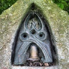 a close up of a rock with a carving on it