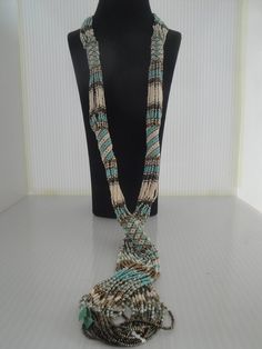 African Zulu beaded rope necklace in blue turquoise , brown and cream Zulu Beads Necklaces, Traditional Multi-strand Turquoise Beaded Necklace, Beaded Rope Necklace Native, Turquoise Long Hand-strung Beaded Necklaces, Southwestern Style Brown Hand-strung Necklace, Herringbone Stitch, Geometric Triangle, Beaded Rope, Zulu