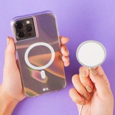 a person holding an iphone case with a magnifying glass on it