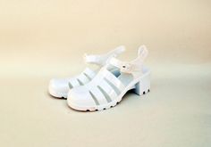 white gel shoes plastic shoes rubber shoes jelly shoes 90s sandals vintage sandals size eu 37 uk 4 us 6 gelly recycled plastic summer shoes ----------------------------------------------------------------------------------- White jelly sandals. Made of 100% PVC! how iconic these shoes are. In new condition could be styled so well. see all images for details Sole is 5 cm ( 2 inches) high in the back and 1.5 cm ( 0.5 inches) in the front side of the shoe Condition : NEW / UNWORN Size Chart: UK Siz White Closed Toe Jelly Sandals For Summer, Casual White Closed Toe Jelly Sandals, White Jelly Sandals With Round Toe For Summer, White Round Toe Jelly Sandals For Summer, White Jelly Sandals With Round Toe For Spring, White Round Toe Jelly Sandals For Spring, White Plastic Jelly Sandals For Spring, White Open Toe Jelly Sandals, Spring White Plastic Jelly Sandals