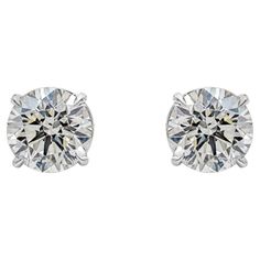 A classic pair of stud earrings showcasing two round brilliant diamonds, each weighing 3.06 carats and 3.02 carats, J-K in Color and SI1-VS2 in Clarity. Set in a simple four prong basket setting, Finely made in 18K White Gold. Roman Malakov is a custom house, specializing in creating anything you can imagine. If you would like to receive a special quote on a custom piece please message or call us. Round Diamond Earrings, Expensive Jewelry Luxury, Basket Setting, Custom House, Jewelry Luxury, Expensive Jewelry, Diamond Stud Earrings, Diamond Stud, Brilliant Diamond