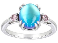 10x8mm Oval Aurora Moonstone With .13ctw Color Shift Garnet Rhodium Over Sterling Silver Ring. Measures approximately .58"L x .39"W. Not sizeable. Finished under gallery. Blue Aurora, Jewelry Blue, Moonstone Jewelry, Blue Violet, Sterling Silver Ring, Moonstone, Garnet, Beautiful Jewelry, Silver Ring