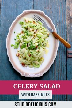 celery salad with hazel nuts on a white plate