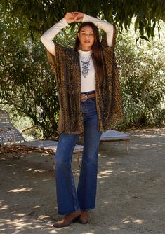 A light-catching kimono topper with a bohemian gold and navy blue velvet burnout design. Velvet burnout Relaxed fit Half-length kimono sleeve Mid-length Side slits Open front Bohemian style cover-up Soft velvet burnout details add an elevated touch to this classic bohemian kimono. With roomy half-length sleeves, an open front, and a versatile mid-length. Perfect for your next special occasion, we love to layer it over a simple fitted top. Model is 5'8, garment is O/S.Style: I-15201W-SLM Bohemian Kimono, Navy Blue Velvet, Velvet Burnout, Dark Indigo, Fitted Top, Kimono Sleeve, Blue Velvet, Top Model, Soft Velvet