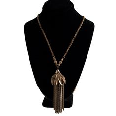 A vintage gold plated tassel necklace. The tassel cap is adorned with rhinestones. A few of them are missing but it isn't very noticeable. The plating shows a little wear but otherwise the piece is in good condition. Perfect for a costume or fun night out! The necklace is 26 inches long and the tassel pendant is 3 inches long. Vintage Rhinestone, Vintage Gold, Tassel Necklace, Tassels, Necklace Etsy, Jewelry Necklace Pendant, Jewelry Necklaces, Pendant Necklace, Accessory Gift