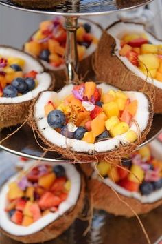 there are many fruits in the coconuts on this platter and it is ready to be eaten