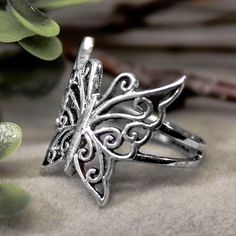 The butterfly spirit animal is one of the most symbolic animals that's associated with personal transformation. Beautiful craftsmanship and exquisite detail by Professional Artist. Stamped/Marked 925 Retains its value as a noble metal as well as its natural beauty and its highly conductive qualities. Fast Secure Shipping/Combined Shipping Available Handmade Silver Adjustable Butterfly Ring, Silver Butterfly Filigree Jewelry, Silver Filigree Butterfly Jewelry, Silver Butterfly Rings With Butterfly Charm, Silver Jewelry With Butterfly Charm, Bohemian Butterfly Ring As A Gift, Bohemian Butterfly Ring As Gift, Silver Metal Butterfly Ring As Gift, Silver Metal Butterfly Ring Gift