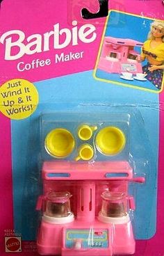 a pink toy coffee maker with two cups on it's top and the words barbie coffee maker