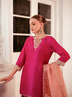 Elevate your style with this intriguing and elegant hot pink silhouette. The ensemble features exquisite embroidered details on the neckline, sleeves and bottom with shade of pink, adding a touch of sophistication and charm. Paired with a contrast organza dupatta, this outfit effortlessly enhances your look, making it perfect for any occasion where you want to make a stylish and memorable impression. Shirt: Raw SilkPants: Raw SilkDupatta: Organza Pink Silhouette, Zainab Chottani, Dressy Clothes, Shade Of Pink, Embroidered Details, Organza Dupatta, How To Iron Clothes, Silk Dupatta, Silk Pants