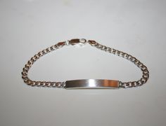 Beautiful Figaro chain bracelet, in silver with satin plate.  It will be an appreciated gift to your partner or your children.  Vintage 70s Made in Italy 925 silver Gloss finish, satin plate Length 21 cm. 5 mm. high. Grams 10 Used, has been polished and cleaned. Since this is pre-owned jewelry, there may be minimal signs of wear. ❤️If you love real vintage, check out my sister and friend's shop! ! Enjoy!! www.etsy.com/it/shop/TheReaItalianVintage www.etsy.com/it/shop/DreamInTheDrawer www.etsy.co Silver Engraved Name Bracelet For Birthday Gift, Silver Engraved Name Bracelet For Birthday, Silver Name Bracelet With Polished Finish As Gift, Silver Name Bracelet With Polished Finish, Engraved Silver Name Bracelet For Birthday Gift, Classic Silver Chain Charm Bracelet As Gift, Silver Curb Chain Bracelets For Gift, Hallmarked Sterling Silver Chain Bracelet Gift, Silver Curb Chain Bracelets As Gifts