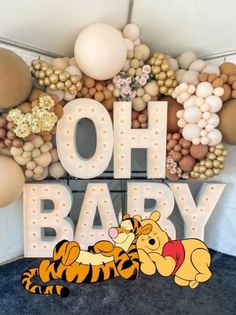 winnie the pooh and tigger balloon arch for baby's first birthday party