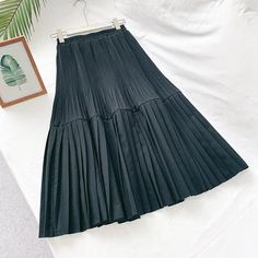 Elegant Solid Color Vintage High Waist Pleated Chic Skirt – lastrafashion Non-stretch Pleated Knee-length Skirt, Non-stretch Cotton Pleated Skirt, Cotton Non-stretch Pleated Skirt, Black Cotton Pleated Skirt For Spring, Spring A-line Pleated Skirt With Elastic Waistband, Black Pleated Hem Skirt For Summer, Summer Black Pleated Hem Skirt, Summer Black Pleated Skirt, Black Pleated Waist Skirt For Spring