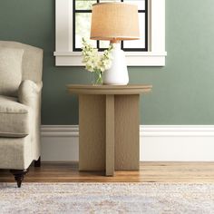 a living room scene with focus on the end table and chair, which has a lamp on it