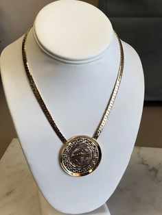 "METAL: 14kt and 18kt Solid Yellow Gold LENGTH: 16 inches WIDTH: 5mm WEIGHT: 30.4 grams CLOSURE: Hidden Box Clasp with Fig 8 safety closure. This custom-made Pendant has beautiful designs of Greek symbols on an 1 3/4\" diameter Disc Plaque. Chain is a 5mm Beveled Herringbone Chain in 16\". FREE SHIPPING Regular Retail Price: $4,789.00" Designer Yellow Gold Necklaces With Polished Finish, Designer Yellow Gold Necklace With Polished Finish, Designer Gold Necklace With Polished Finish, Designer Yellow Gold Polished Necklace, Classic Engraved Snake Chain Jewelry, Luxury Gold Chain Necklace With Medallion, Luxury Gold Chain Medallion Necklace, Luxury Engraved Pendant Chain Necklace, Luxury Formal 14k Stamped Necklaces