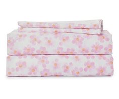 two sheets with pink flowers on them and one is folded up in front of the other