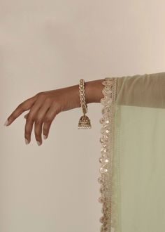 Adorn your wrists with the refined elegance of our antique gold Saavana Bangles, featuring almond-shaped gems and cream stones. The dangling jhumkas add a touch of sophistication, perfect for standalone chic or curated bangle ensembles. Includes 2 bangles. Gold Kangan, Beautiful Bangles, Cream Stone, Almond Shaped, Classic Elegance, Free Giveaway, Antique Gold, Almond, Bangles