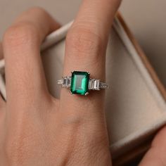 This ring features a 7*9 mm emerald cut lab emerald and sterling silver finished with rhodium. Customization is available. It is made by hand, and it will take about 7 days to finish the ring after your payment is completed. Main stone: lab emerald Main stone weight: Approx 2.1ct Metal type: sterling silver finished with rhodium Accent stone: CZ Customization is available, I also can make it with 14k solid gold (white or yellow or rose) and diamond accent stone, just feel free to contact me. Any Emerald Ring Wedding, Emerald Cut Wedding Ring, Wedding Ring Emerald Cut, Wedding Ring Emerald, Wedding Rings Emerald Cut, Lemon Quartz Ring, Original Engagement Rings, Ring Emerald Cut, Emerald Wedding Rings