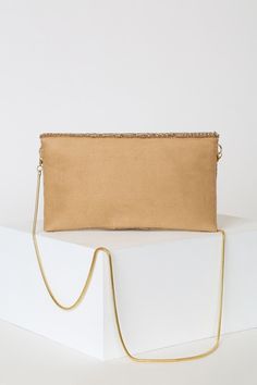 No elegant evening is complete without the Lulus Junipero Gold Beaded Clutch! This chic vegan suede envelope clutch features an eye-catching display of gold beads across a scalloped front flap with magnetic closure. Structured, lined interior features a sidewall pocket perfect for holding all your goodies! Carry as a clutch or attach the matching gold crossbody chain strap. Gold hardware. Lined. Clutch measures 9" wide, 5" tall, and 1" deep (relaxed). 46" detachable gold chain. Glass and plastic Beige Clutch With Magnetic Closure For Formal Events, Beige Envelope Clutch For Party, Formal Beige Clutch With Magnetic Closure, Chic Embellished Evening Bag, Beige Envelope Clutch For Evening, Elegant Gold Bag With Magnetic Closure, Embellished Beige Evening Bag, Beige Embellished Evening Bag, Chic Gold Embellished Evening Bag