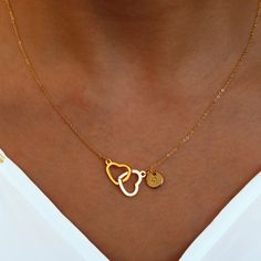 "These necklaces feature two intertwined hearts, each personalized with an initial, creating a sweet and unique piece. Crafted with care, they make the best gift choice for her, reflecting both your sentiment and her individuality. Embrace the charm of double hearts and make her feel cherished with our Double Heart Initial Necklaces, a cute and meaningful accessory that she'll treasure. #YOU MAY LIKE THIS Silver Roman Numerals Dainty Necklace https://www.etsy.com/listing/1494830562/silver-roman- Intertwined Hearts, Angel Pendant Necklace, Gold Heart Locket, Engraved Bar Necklace, Heart Choker Necklace, Initial Necklaces, Chevron Necklace, Christmas Necklace, Bridesmaid Gifts Jewelry