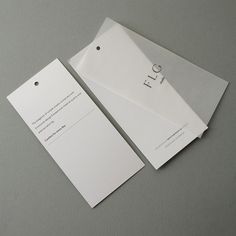 two white envelopes sitting next to each other