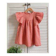 "Girls dress made of 100% cotton. Butterfly sleeve. Muslin fabric. Please, note when choosing a size. Be guided by the age and height of the child. This is a loose dress, choosing a larger size will make the dress too big. Avalible sizes (child height ): US 2 (approx height 34\"/86cm) US 3 (approx. height 38\"/96cm) US 4 (approx. height 41\"/104cm) US 5 (approx. height 44\"/112cm) US 6 (approx. height 47\"120cm) US 7 (approx. height 50\"/127cm) US 8 (approx. height 52\"/132cm) The item is made t Short Sleeve Cotton Dress With Ruffles, Summer Cotton Dress With Ruffle Sleeves, Pink Short Sleeve Cotton Dress, Beach Dress With Ruffle Sleeves In Cotton, Cute Butterfly Sleeve Beach Dress, Cute Cotton Dress With Flutter Sleeves, Summer Cotton Sundress With Flutter Sleeves, Spring Cotton Dress With Ruffle Sleeves, Cotton Spring Dress With Ruffle Sleeves