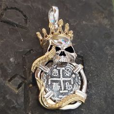 This piece is part of my pirate and skull collection. The coin is made from the silver bars recovered from the Atocha and comes with a certificate stating that.  The frame is solid sterling silver, and the crown and tentacles are a 14kt gold vermeil.  I also set the crown with genuine rubies for a beautiful contrast.  I sign my name on the back so you know you are getting a JackSpirit original design. Pirate Compass Tattoo, Pirate Compass, Sunken Treasure, Skull Collection, Pirate Jewelry, Treasure Coin, Element Necklace, Key West Fl, Nugget Necklace