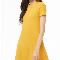 New With Tags. Mustard Colored. Buy With Confidence! Posh Ambassador Top Rated Seller Fast Shipper (1 Day) Top 10% Seller Top 10% Sharer Posh Mentor Forever 21 Yellow Mini Dress For Spring, Mustard Short Sleeve Mini Dress, Knitted Tshirt, Forever 21 Dresses, 21 Dresses, Waffle Knit, Orange Yellow, Swing Dress, 1 Day