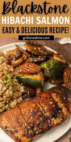 a white plate topped with salmon, rice and veggies covered in black sesame seeds