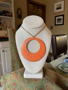 If you could picture a necklace from the 60s, it might look just like this. Super fun, psychedelic, and big circle - 3.75 round, cool pebble surface. 18-inch drop on the chain, 36 inches in total. This is not an expensive piece, and it is unsigned, but it is very stylish and well made, wear with a cream turtleneck, a brown corduroy jacket, jeans and boots, and top it off with a floppy 60s hat! Free shipping, always! Fall jewelry, orange jewelry, mod jewelry, 60s necklace, 60s pendant, groovy mod necklace, hippie jewelry, retro necklace, hipster, hippie, orange, gold, fall colors, affordable jewelry, vintage jewelry, summer jewelry Retro Metal Necklaces With Adjustable Chain, Retro Metal Necklace With Adjustable Chain, Retro Pendant Metal Necklace, Retro Metal Pendant Necklace, Retro Round Metal Necklaces, Retro Round Metal Necklace, Bohemian Circle Metal Necklace, Retro Metal Necklaces For Festivals, Retro Jewelry With Adjustable Chain