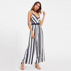 This striped jumpsuit is simply perfect! Featuring a plunging v-neckline with spaghetti straps, an open back, a cinched waist and flared legs. This jumpsuit both sassy and sweet, pairing perfectly with wedges, heels or sandals. Made with a polyester blend for comfort and style. Striped V-neck Jumpsuits And Rompers For Summer, Striped V-neck Jumpsuits For Vacation, Striped Jumpsuits And Rompers For Party, Chic Striped Summer Jumpsuits And Rompers, Chic Striped Jumpsuits And Rompers For Beach, Chic Striped Jumpsuits And Rompers For Summer, Elegant Striped Sleeveless Jumpsuits And Rompers, Spring Striped Overall Jumpsuits And Rompers, Striped Overalls Jumpsuits For Spring