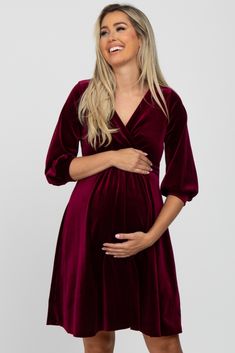 A stylish maternity dress perfect for cocktail parties and special occasions.  A velvet maternity dress featuring a wrap front v-neckline, 3/4 length sleeves and a pleated empire waist. The Burgundy Velvet Wrap Front Babydoll Maternity Dress is perfectly bump-friendly! Velvet Maternity Dress, Maternity Romper, Postpartum Nursing, Chat Icon, Floral Maternity Dresses, Stylish Maternity Outfits, Trendy Maternity, Burgundy Velvet, Nursing Friendly