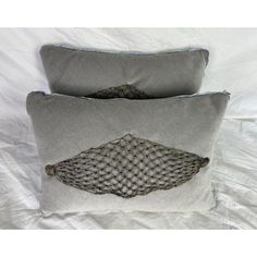 two gray pillows with fishnet design on them