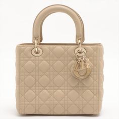 Elevate your style with this stunning second-hand Lady Dior Medium Cannage Leather Beige Bag, perfect for fashion-conscious women. The bag boasts an exquisite beige colour and gold-toned hardware. The gently used piece has a suede leather interior and a practical flap design. Lady Dior Medium, Wallet Chains, Beige Bag, Beige Colour, Handbag Wallet, Wallet Accessories, Casual Backpack, Lady Dior, Elevate Your Style