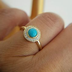 14k Gold Plated Over Sterling Silver With Round Blue Synthetic Turquoise Stone Ring Available In Sizes 5 6 7 8 9 Item#Dgr1653-9. Turquoise Jewelry With Halo Setting For Gift, Turquoise Jewelry With Halo Setting As A Gift, Yellow Gold Turquoise Birthstone Ring, Elegant 14k Gold Turquoise Birthstone Ring, Blue Turquoise Ring In 14k Gold, Blue Turquoise 14k Gold Fine Jewelry Ring, Elegant Gold Turquoise Ring With Bezel Setting, Elegant Gold Turquoise Round Ring, 14k Gold Blue Turquoise Ring