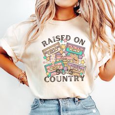 Comfort Colors® Raised on 90s Country Shirt,Country Tshirts for Woman Country Concert Tee, Retro 90's Country Shirt, Country Music Lover Shirt,Southern Farm Shirt, Greetings! *ABOUT OUR T-SHIRT QUALITY Skillfully printed with our state-of-the-art printing machine. Key Features of Comfort Colors 1717 Unisex Heavyweight Tee 6.1 oz./yd² (US), 10 oz/L yd (CA), 100% ring-spun cotton, 20 singles Soft ring-spun fabric dyed for a unique look Relaxed fit for ultimate comfort Topstitched, classic width, r Retro Relaxed Fit T-shirt For Music Festival, Retro T-shirt For Summer Country Concerts, Cotton Crew Neck Tops For Music Festivals, Relaxed Fit Top With Letter Print For Music Festivals, Relaxed Fit Letter Print Tops For Music Festivals, 90s Relaxed Fit Top For Fan Merchandise, Trendy Cotton Tops For Music Festivals, Vintage Slogan T-shirt For Concerts, Retro T-shirt For Country Concerts In Summer