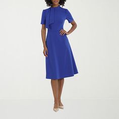 The tie-neck detail and classic fit-and-flare silhouette of this Ivy & Blue women's dress makes it perfect for work, formal events, or a stylish night out. Crafted from stretch-crepe, it has a mandarin collar, short sleeves, a midi-length, and a zipper closure. Wear it with pointed-toe pumps for a polished look.Closure Type: ZipperNeckline: Split Tie NeckSleeve Length: Short SleeveApparel Length: 45 Inches - BackDress Length: Midi LengthFiber Content: 96% Polyester, 4% SpandexFabric Description: Flare Dresses, Work Formal, Stretch Crepe, Fit N Flare Dress, Tie Neck, Mandarin Collar, Fit Flare Dress, Dress Blue, Polished Look