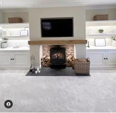 a living room filled with furniture and a flat screen tv mounted above a fire place