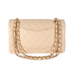 Listing Title: Chanel Beige Lambskin Medium Classic Double FlapSKU: 128537MSRP: 8800.00Condition: Condition Description: A timeless classic that never goes out of style, the flap bag from Chanel dates back to 1955 and has seen a number of updates. The design was revolutionary for its time, giving its wearers the freedom to carry their everyday must-haves without the cumbersome nature of a larger bag. The bag features the classic leather-entwined chain-link shoulder strap for a distinctive aesthetic.Handbag Condition: Very GoodCondition Comments: Very Good Condition. Exterior corner scuffing. Light scratching at hardware. Interior indentation, marks and scuffing.Brand: ChanelModel: Classic Double FlapOrigin Country: ItalyHandbag Silhouette: Crossbody Bag;Shoulder BagOccasions: Evening;Every Chanel Beige, Beige Handbags, Chanel Model, Large Bag, Classic Leather, Fendi Bags, Flap Bag, Timeless Classic, Out Of Style