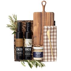 the gift box includes two bottles and a cutting board