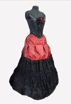 This Gothic Steampunk Victorian outfit in black and dark red is perfect for formal occasions. The Raven SDL designer brand brings a unique and edgy style to the outfit. The black colour gives a classic touch while the deep red adds a pop of colour to the ensemble.  The outfit is perfect for weddings, proms, and other formal events. It is new with tags and in pristine condition. The quality of the outfit is exceptional and will make you stand out in any crowd. Get ready to make a statement with t Black Steampunk Corset For Halloween, Steampunk Black Corset For Halloween, Punk Red Skirt For Halloween, Punk Style Red Skirt For Halloween, Black Steampunk Corset For Costume Party, Black Steampunk Corset Dress For Halloween, Black Steampunk Corset Dress For Cosplay, Gothic Fitted Corset Dress For Alternative Fashion, Black Fitted Gothic Corset Dress