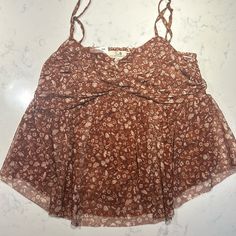 Daisy & Delilah Nwt. Size Large. Rose (Brownish) Base Color More With Crme/Tan Flowers And Mushrooms. Very Stretchy. Raw Bottom Hem. Adjustable Spaghetti Straps. Does Not Fit Me. Please See Photos For Measurements And Condition. Smoke Free And Pet Friendly Home. Brown Tops With Adjustable Straps For Summer, Flowers And Mushrooms, Tan Flowers, Stretchy Tops, Base Colour, Pet Friendly, Spaghetti Strap, Spaghetti, Daisy