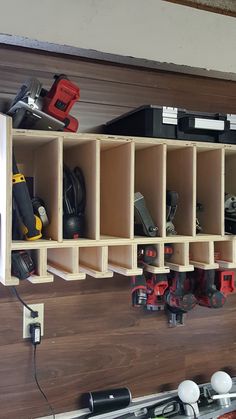 there are many different tools on the wall in this garage storage area, including drillers and screwdrivers